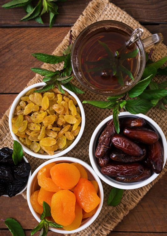 Assortment of natural dried fruits served with mint tea